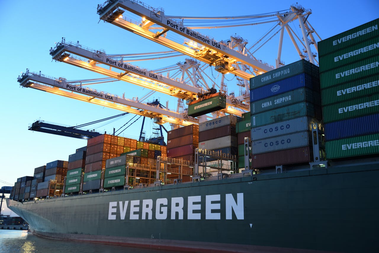 Home An Evergreen container ship loading at the Port of Baltimore during daytime.