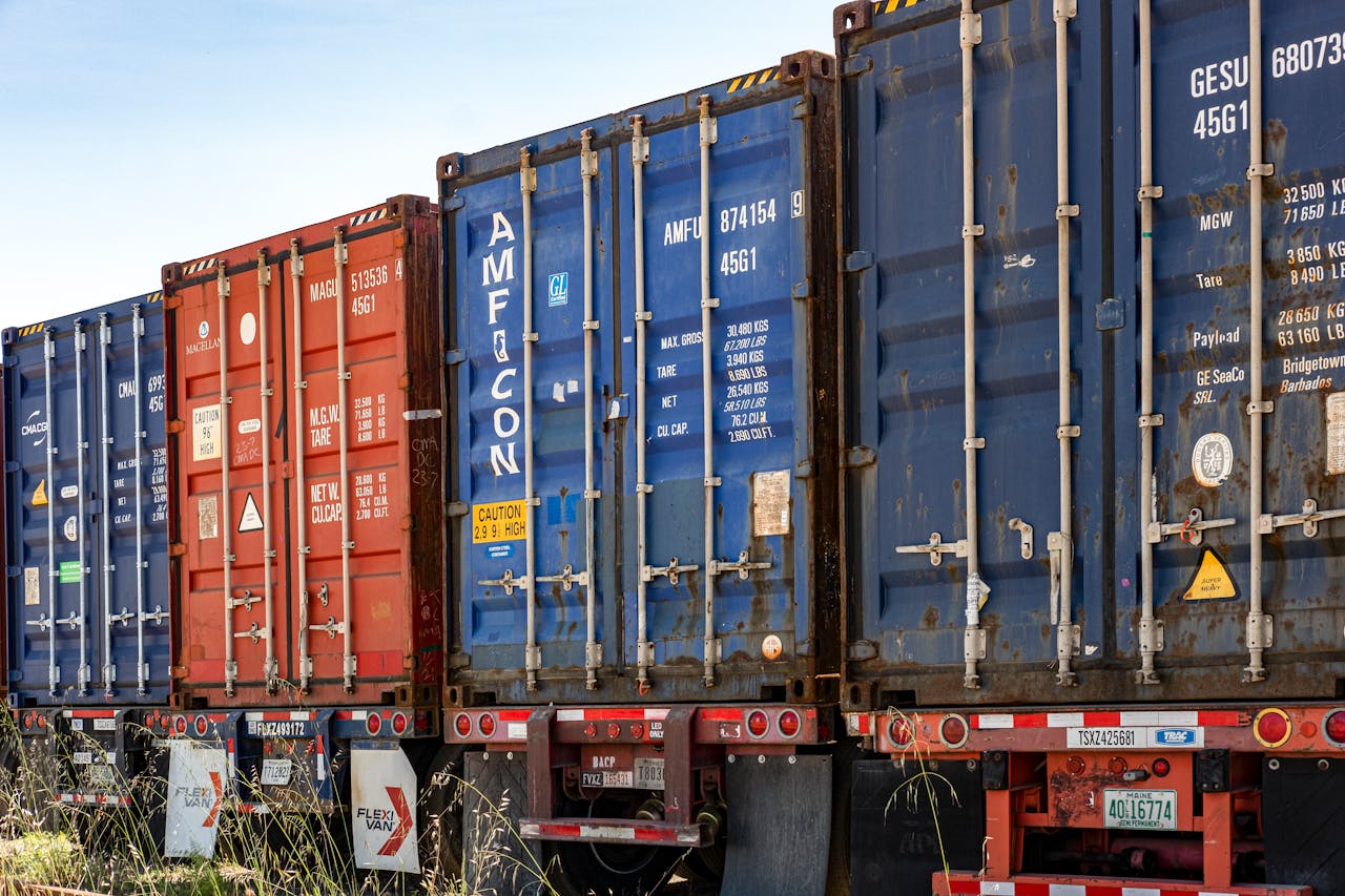 The Art of Drawing Readers In: Your attractive post title goes here Row of colorful cargo containers in an industrial shipping yard, ready for transportation.