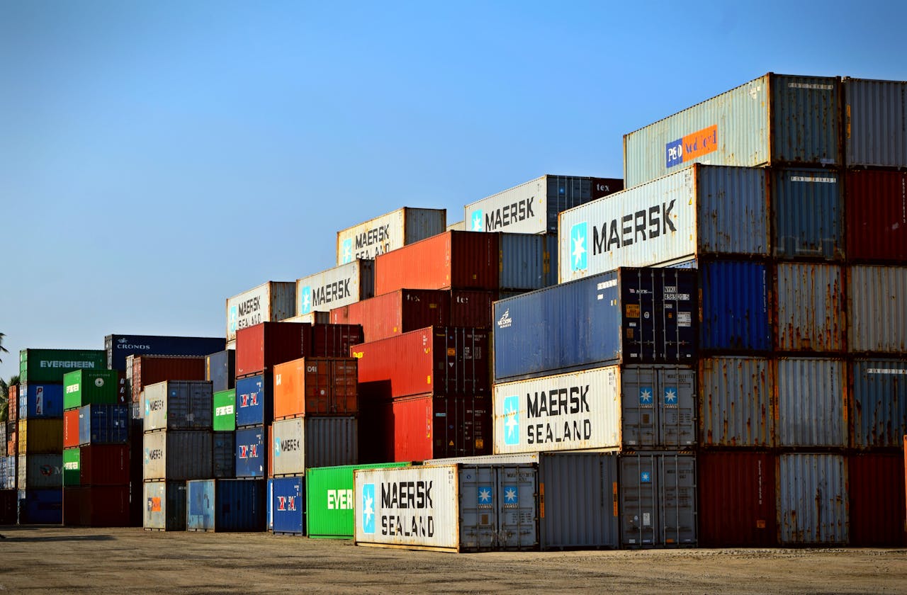 Mastering the First Impression: Your intriguing post title goes here Colorful stacked shipping containers at a port exemplify global logistics.